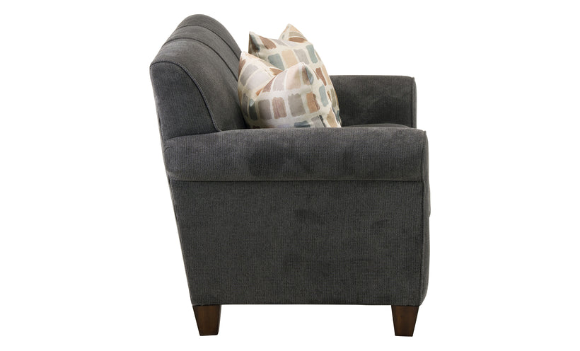 Gray sofa with a patterned pillow on a white background
